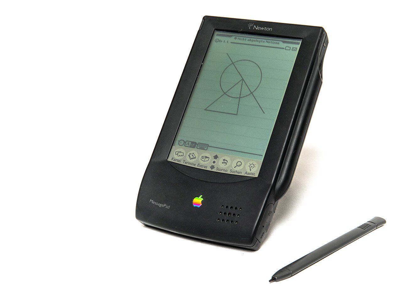 Apple Newton MessagePad 100 with its stylus resting on the screen