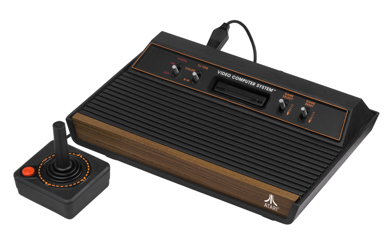 An Atari 2600 wood-grain console set, period hardware from the era before web animation