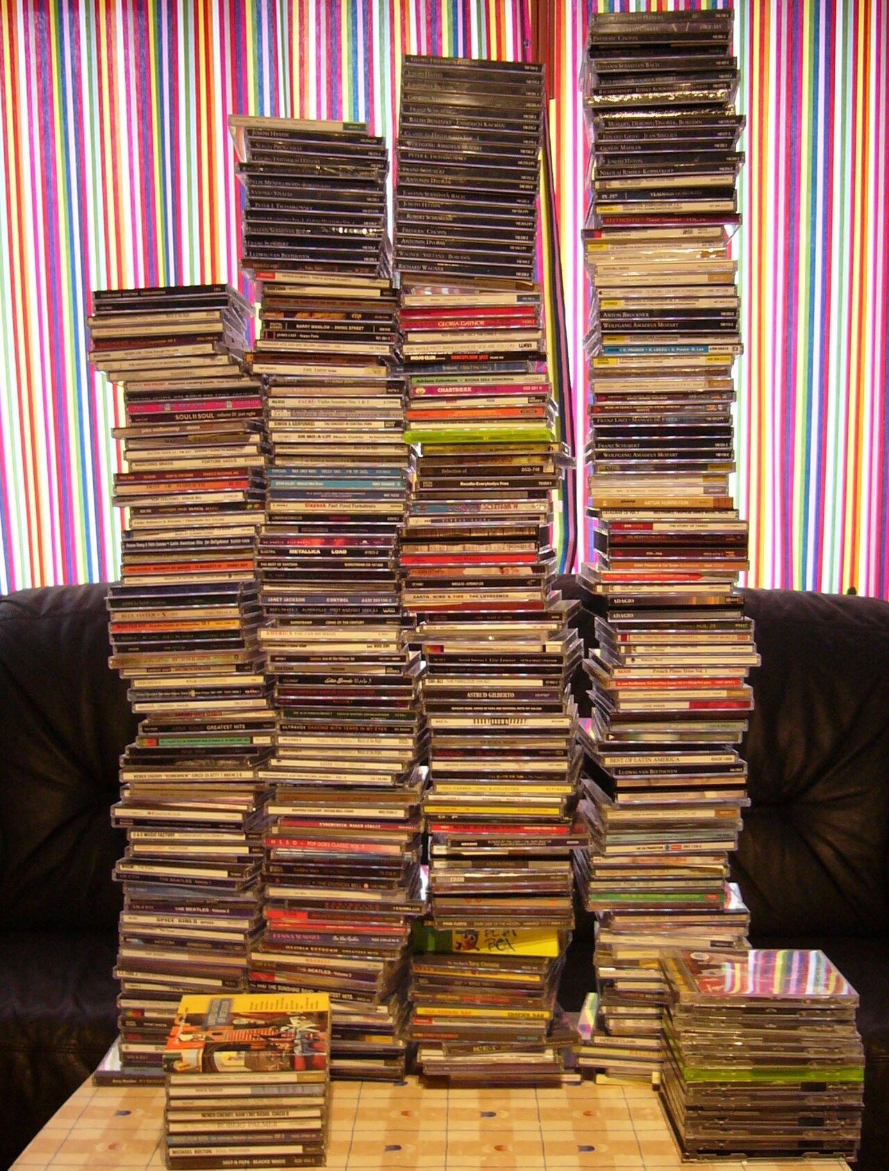 A collection of PC game CDs in jewel cases from the late 1990s