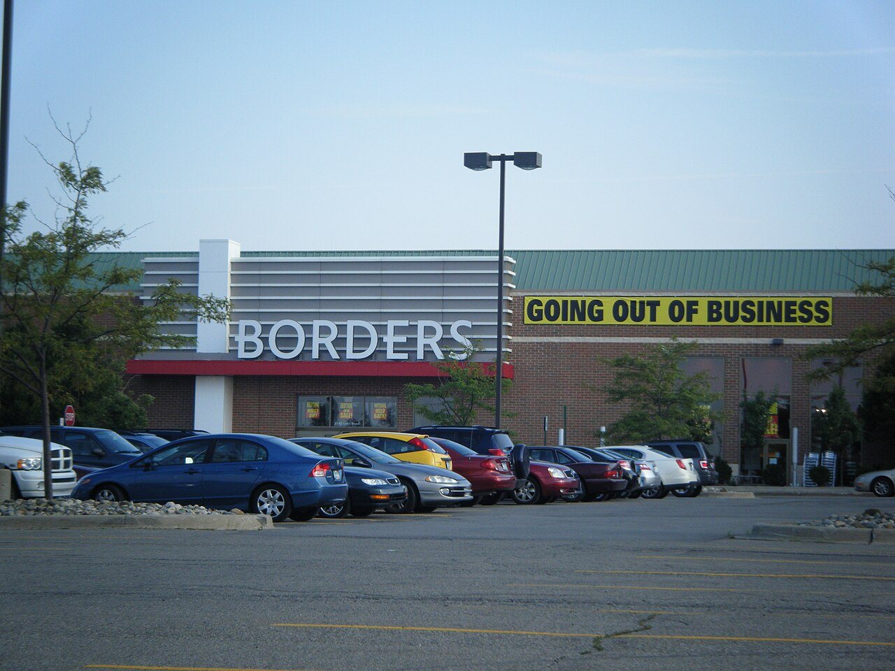 The exterior of a Borders bookstore with the chain's sign above the entrance