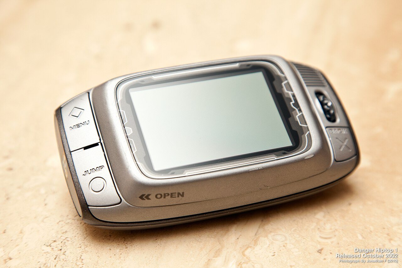 A T-Mobile Sidekick with its screen swiveled open to show the QWERTY keyboard underneath