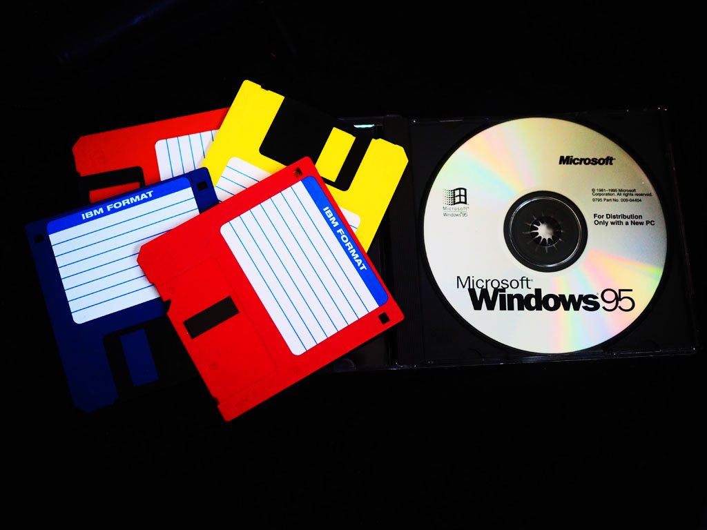 Floppy disks and a CD-ROM of the Windows 95 installer