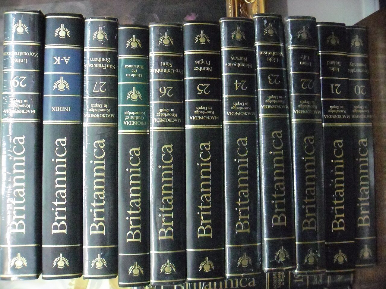 A row of bound Encyclopaedia Britannica volumes on a shelf
