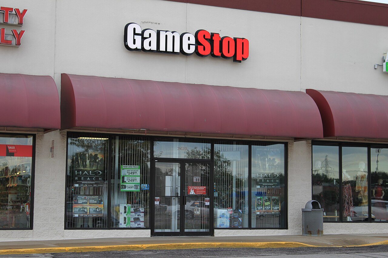 A GameStop store front with the company's black and white sign above the entrance