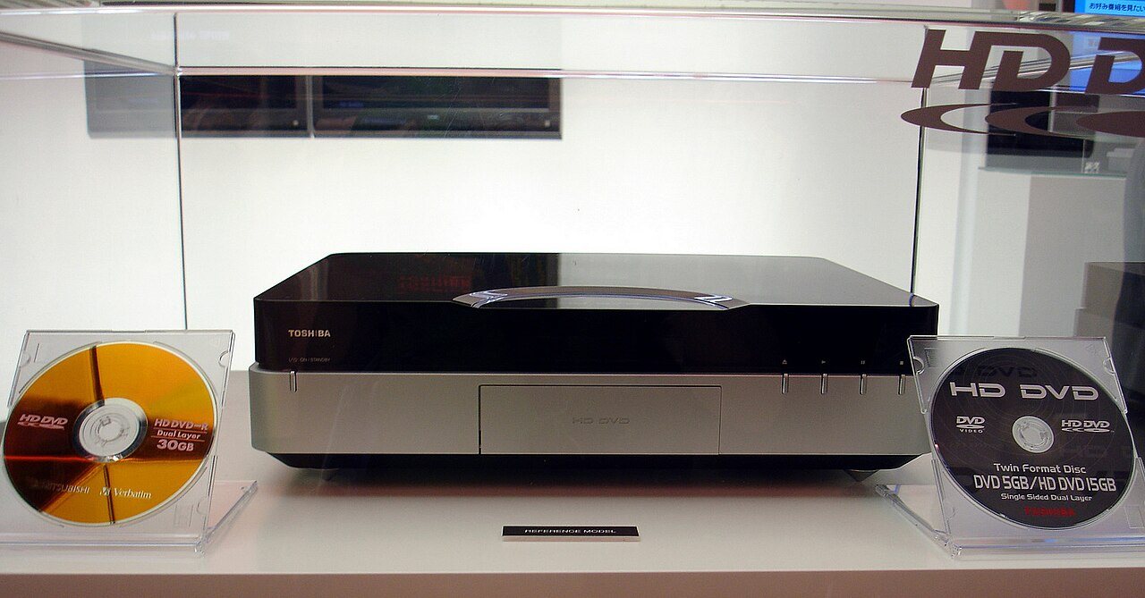 The Toshiba HBS-A001 HD DVD player on display at IFA 2005 in Berlin, alongside HD DVD discs
