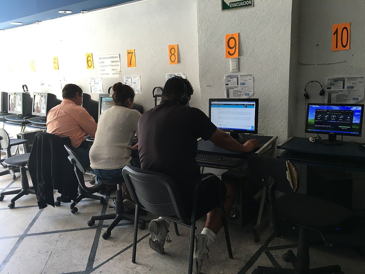 An internet cafe from the early 2000s, with rows of computers where users accessed the first social networks