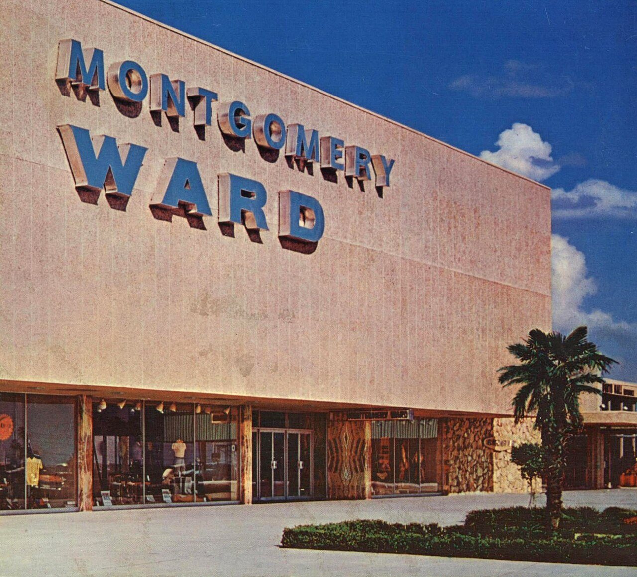 A Montgomery Ward department store with the company name across the front of the building