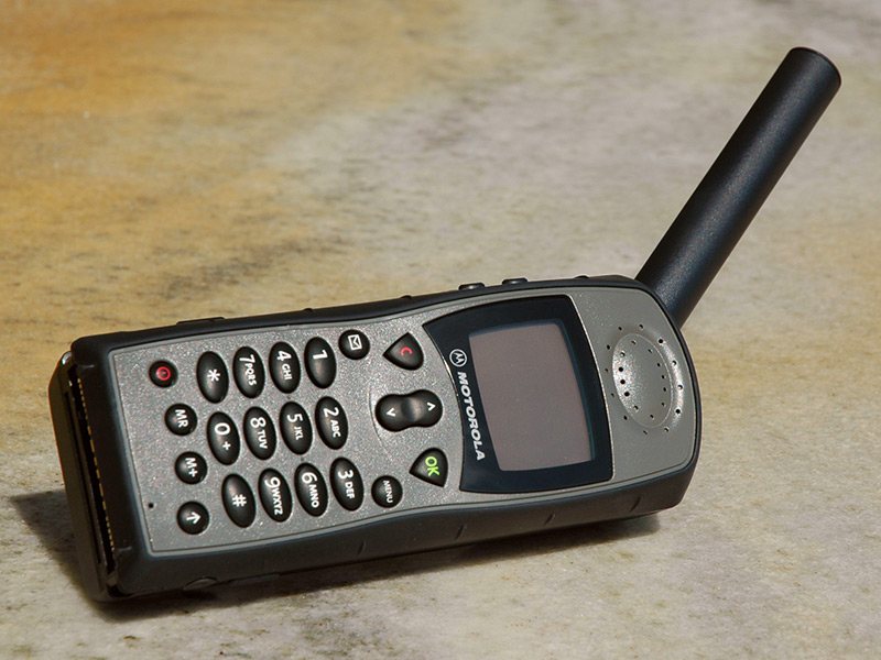 A Motorola 9505 Iridium satellite phone with its thick extendable antenna