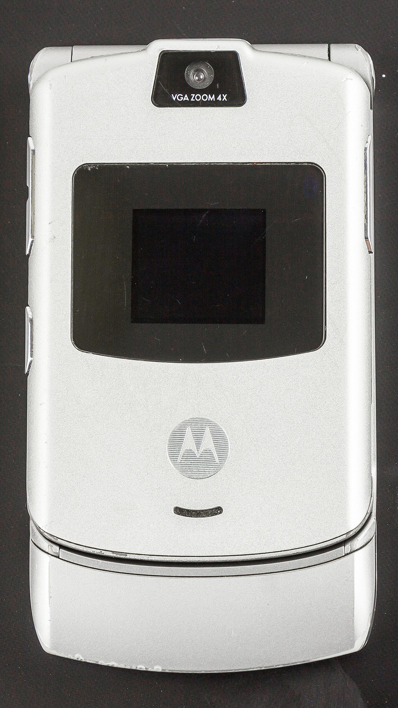A silver Motorola Razr V3 flip phone open to show its keypad and screen