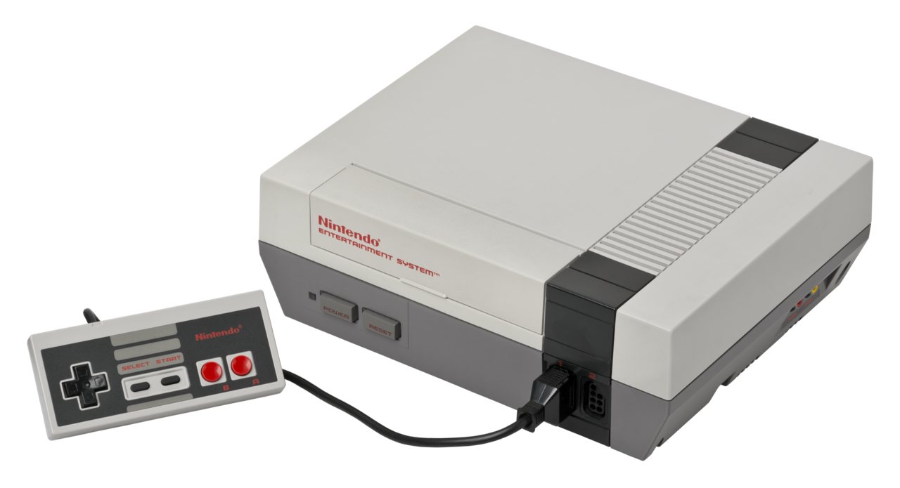 A grey Nintendo Entertainment System console with its controller and a cartridge, the hardware the Game Genie plugged into