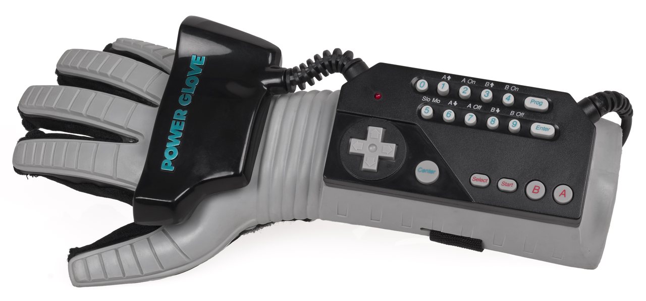 The Mattel Power Glove for the Nintendo Entertainment System, a grey and black forearm controller with a directional pad and numeric keypad on the wrist