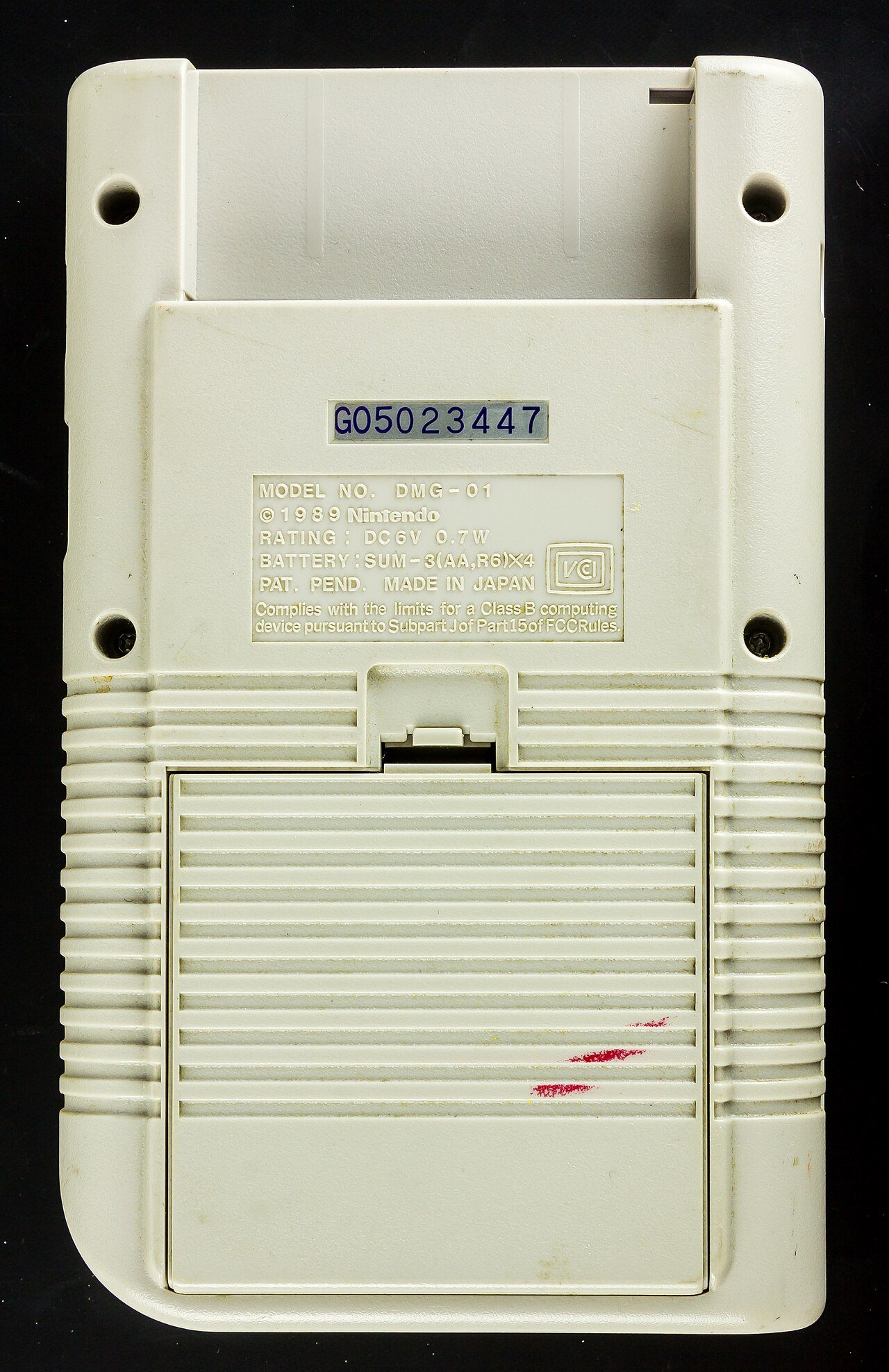 Original Nintendo Game Boy DMG-01 handheld with its gray shell, green screen and four face buttons