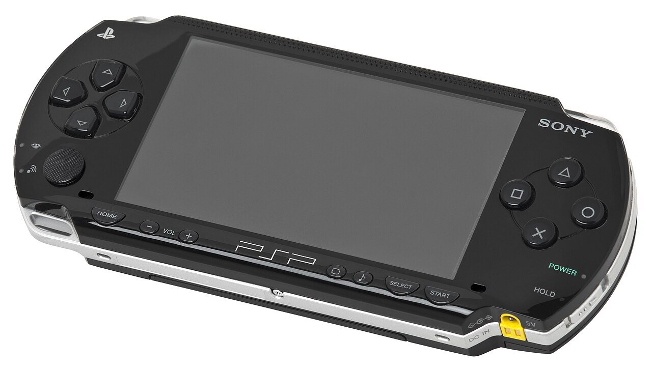 Original Sony PSP-1000 handheld console, front view, showing the 4.3-inch widescreen display and the analog nub