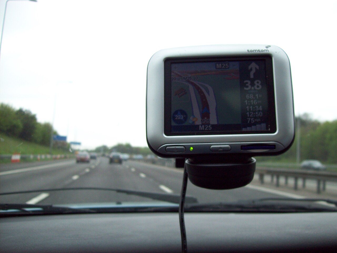 A TomTom Go personal navigation device, the 2004 all-in-one car navigator