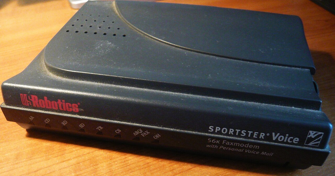An external 56k dial-up modem connected to a telephone line