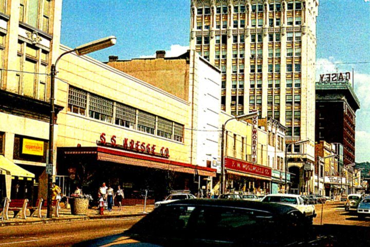 An F. W. Woolworth five-and-dime storefront with the chain's sign above the display windows